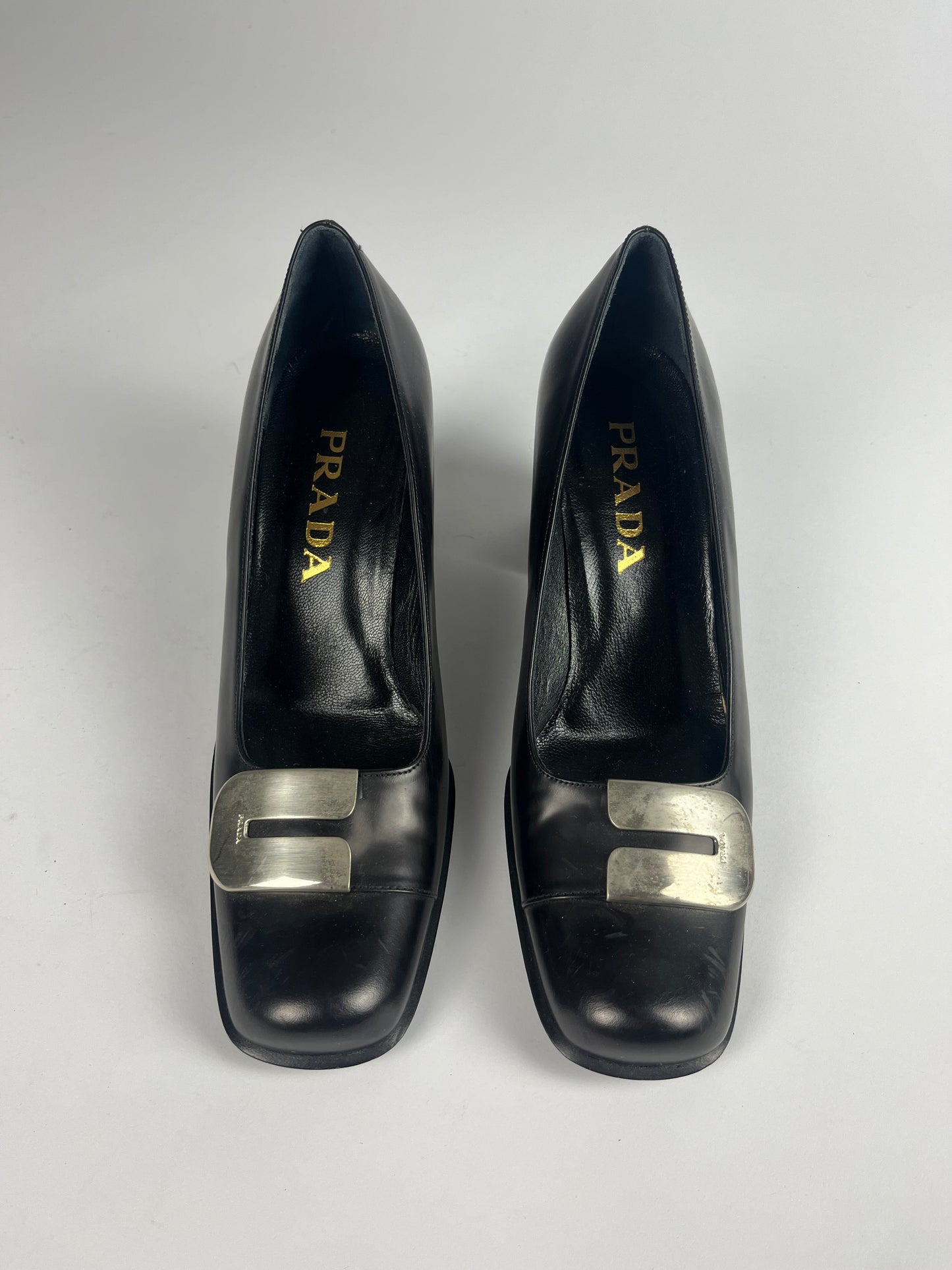 Prada Metallic Buckle Black Leather Pumps - 38 IT/39 EU